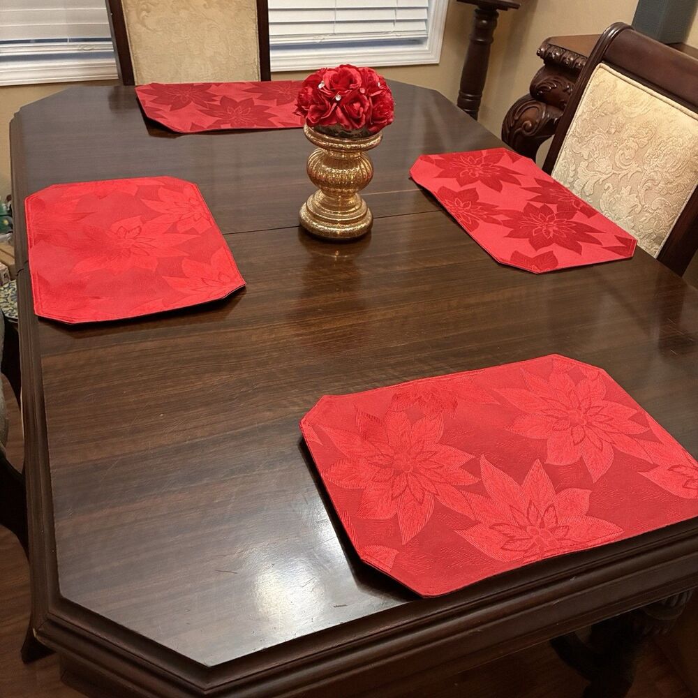 4 Piece Set Of Red Placemats With Poinsettia Design. Measures 12”x18”.